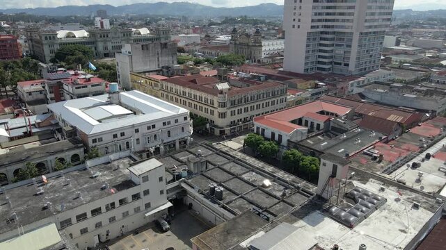 Aerial descending view of downtown guatemala city rooftops La Perla Zona 1