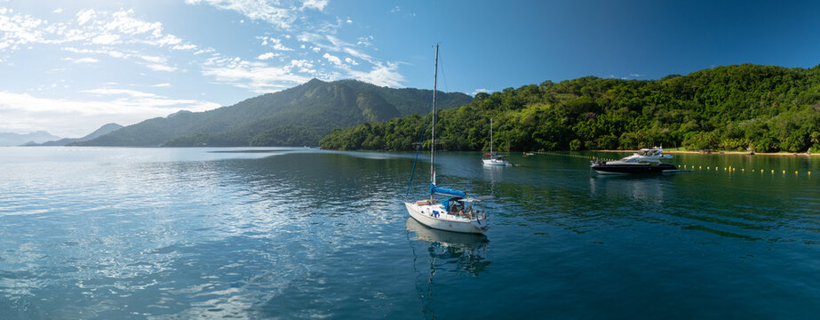 Aerial panorama of the sailing boat anchored in the calm lagoon in Brazil. Area of the island of Ilha Grande near the town of Angra dos Reis