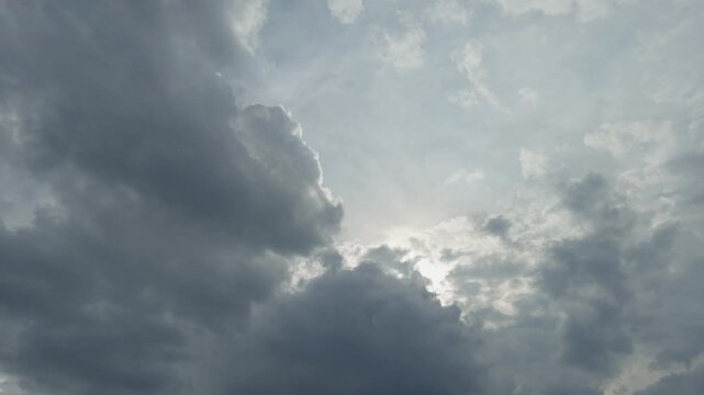 Bright cloud scene. Sunlit textured cumulus clouds. Illuminated clouds with vivid highlights and depth. Dramatic sunlit cloud formations with atmospheric richness and motion