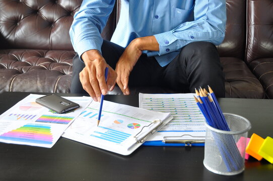 Accountant women hands pointing excel stat financial spreadsheet business graph charts make summary report. Excel graph with Spreadsheet Document showing Information Financial Startup Concept. Man