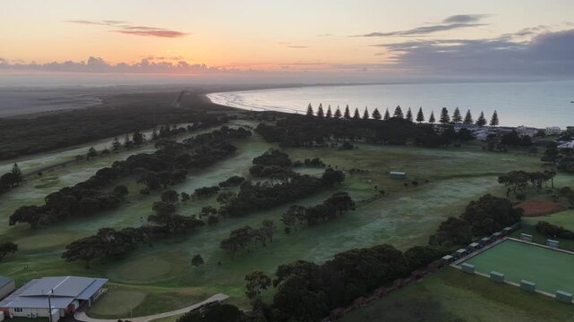 Beachport, South Australia at sunrise: 4K aerial drone footage of coastal town, golf course, calm ocean, surf beach and golden morning light.