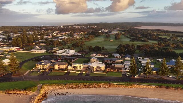 Beachport, South Australia at sunrise: 4K aerial drone footage of coastal town, jetty, calm ocean, Southern Ocean Beach and golden morning light