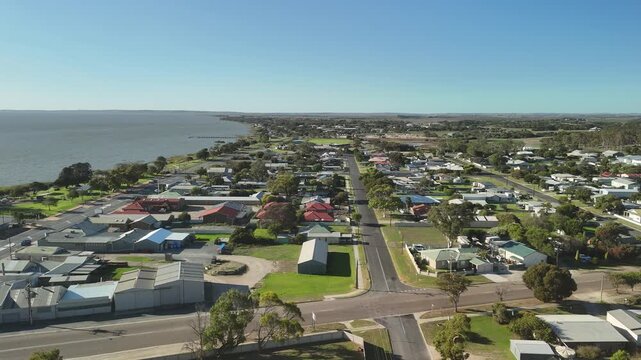 Meningie, South Australia: 4K aerial drone footage of Lake Albert, waterfront township, marina, houses, residential estates, streets, traffic, wetlands and riverside landscape