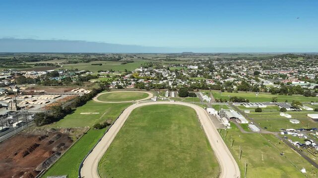 Mount Gambier Showgrounds, South Australia: 4K aerial drone footage of event grounds, oval track, open field and surrounding suburb near Umpherston Cave