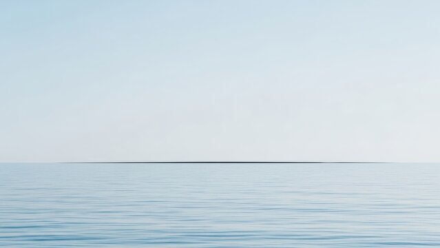 Minimalist seascape with a calm sea and a thin line of land on the horizon.