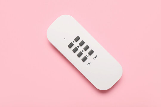 Remote controller for lighting on pink background