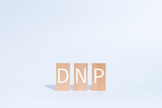 Eye-catching image of DNP text on wood blocks. The word stands for Distributed Network Protocol.