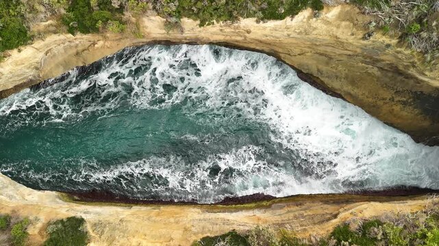 Poombeeyt Koontapool lookout, Great Ocean Road, Port Campbell, Victoria, Australia: 4K aerial drone footage of coastal blowhole, limestone cliffs, ocean waves, coastline. 