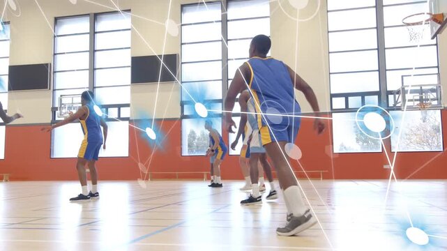 Light-blue offense dribbling on court, forcing rotation to create shot, broadcast nodes tracking