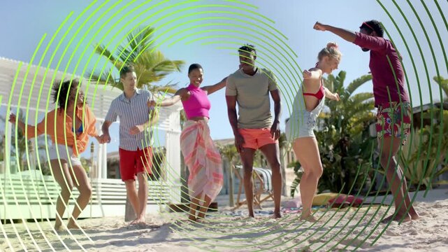 Six friends dancing on beach after green round overlay pulsing over group showing travel marketing