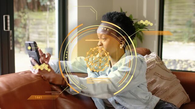 Woman tapping smartphone reclining on couch, engaging HUD overlay centering face exploring tech