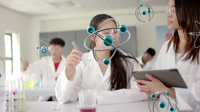 Student raising test tube and causing animated atomic models orbiting around science lab for study
