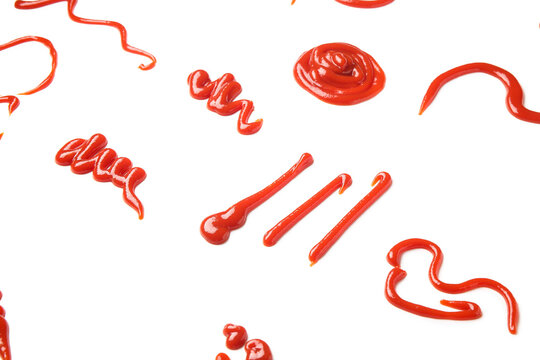 Different patterns made of tasty ketchup isolated on white background