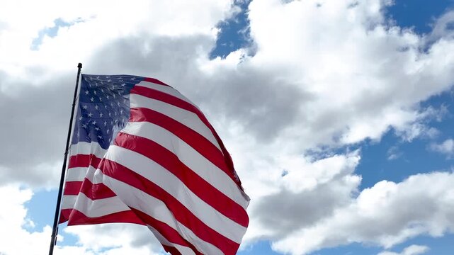 Stars and Stripes Waving with Cinematic Motion Against Clouds