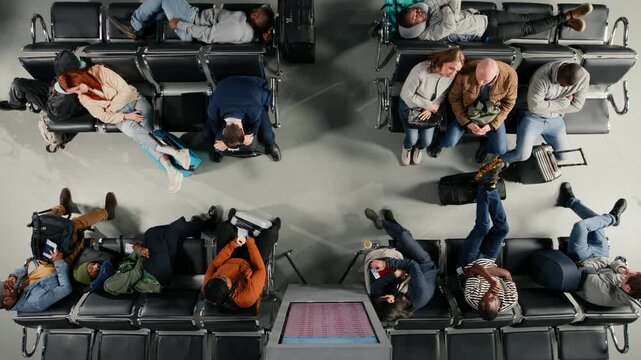 Shouting, flight delay and angry people making annoyed phone calls in busy airport terminal, top down view. Yelling, flight cancelation and frustrated travelers upset by losing plane