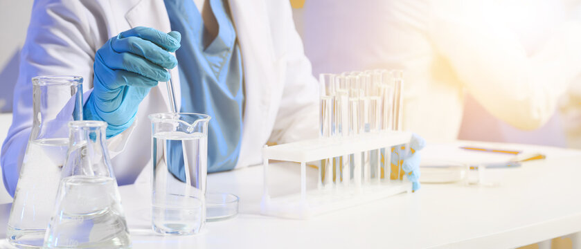 Female scientist studying samples in laboratory, closeup