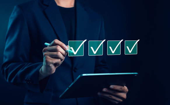 Checklist verification concept with hand marking checkboxes on virtual interface, quality control, task completion, workflow management, productivity, business process, digital technology
