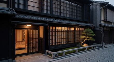 Fototapeta premium Modern Japanese-inspired house features dark timber cladding, large shoji-style glass panels, serene zen garden with gravel and a tree at early morning