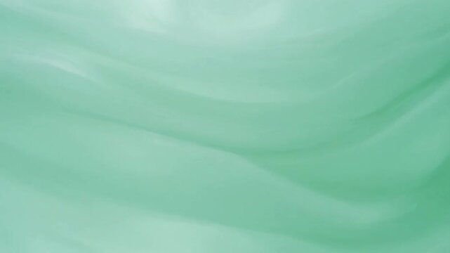 Soft flowing green fabric texture