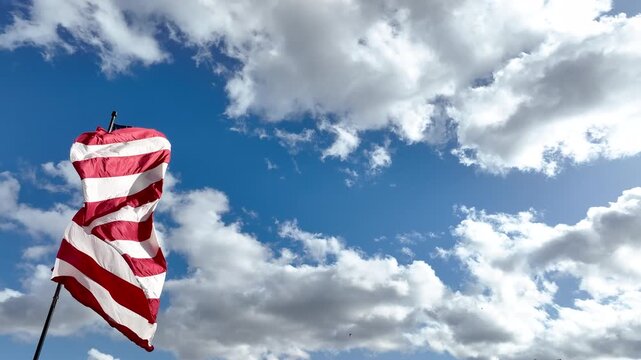 American Flag Blowing in Gentle Wind with Copy Space in Sky