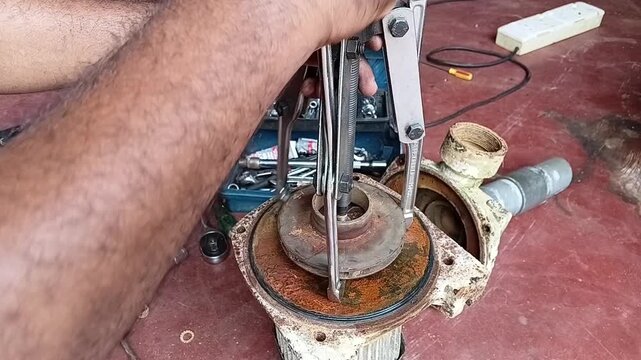 Fast Motion Time Lapse of Removing a Tight Water Pump Impeller Using a Mechanical Bearing Puller Tool