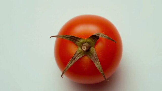 3D tomato with mic spinning on white background with three falling tomatoes for YouTubers, food bloggers, and marketers. Ideal for podcast intros, comedy skits, food channels, and social media.
