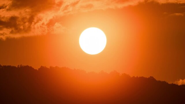 Peaceful morning time-lapse of sunrise in the mountains, soft clouds moving over a high altitude landscape.