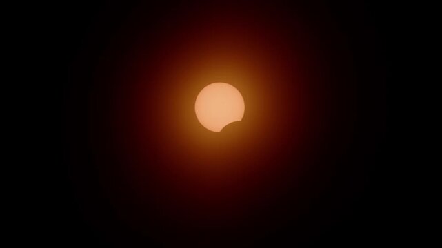 Cinematic footage of the partial solar eclipse creating a perfect glowing crescent sun in the sky above Halifax, Nova Scotia on April 8, 2024. Rare and beautiful astronomical event in Canada 4K.