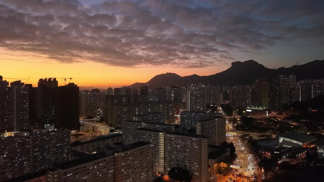 Golden sunset illuminates Choi Hung skyline and towers Feb 5 2026