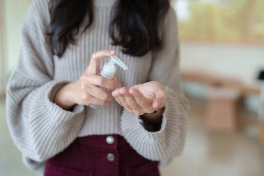 Person applying hand sanitizer to clean hands
