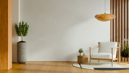 Minimalist interior living space mockup with white armchair wooden slats and potted plant on hardwood floor- 3D rendering © Vanitjan