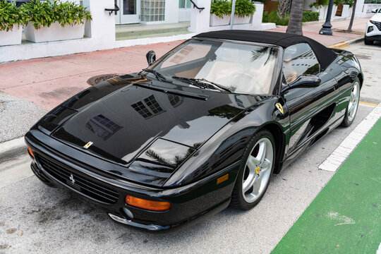 Miami, Florida, USA - July 27, 2025: Ferrari F355 Spider 1996 convertible car. Convertible car Ferrari F355 Spider. Car Ferrari F355 Spider parked outdoor. Black convertible, corner view