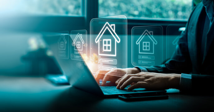 Business professional using laptop with digital house interface for property selection real estate search system smart home investment and online housing marketplace technology