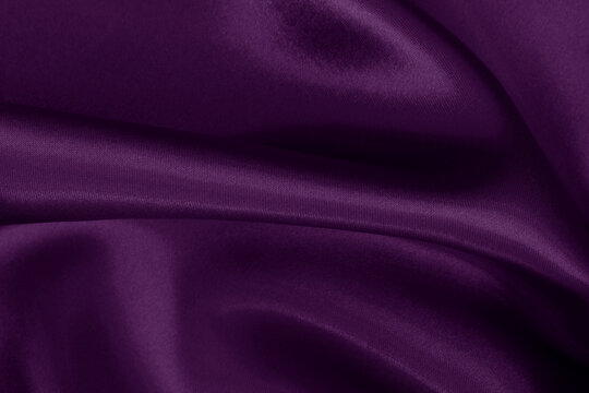 Purple fabric cloth texture for background and design art work, beautiful crumpled pattern of silk or linen.