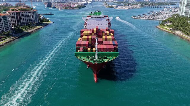 Cargo ship with container. Freight container loaded on cargo vessel. big cargo ship leaving harbor. Container ship.
