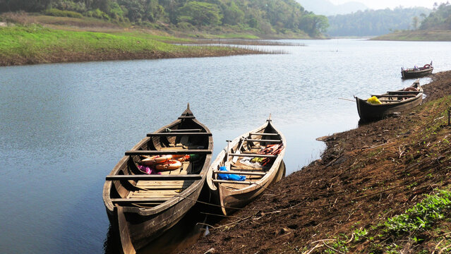 Wooden boats are parked on the banks of Periyar River at Ayyappankovil in Idukki, Kerala, India