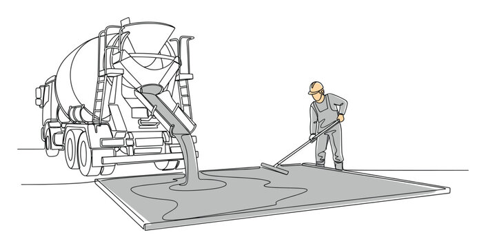 Construction worker spreading fresh concrete poured from a mixer truck at a building site