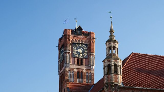 The clock tower of the Old Town Hall and District Museum in Toruń, Poland.