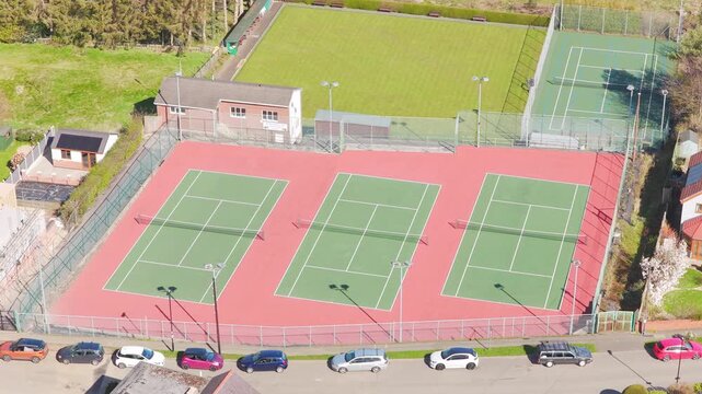 Stocksbridge Tennis Club in South Yorkshire, England, United Kingdom with three outdoor hard courts built to ITF dimensions and nets drone top down aerial shot
