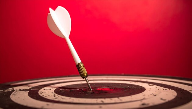 dart piercing bullseye on vibrant red gradient background with dramatic lighting