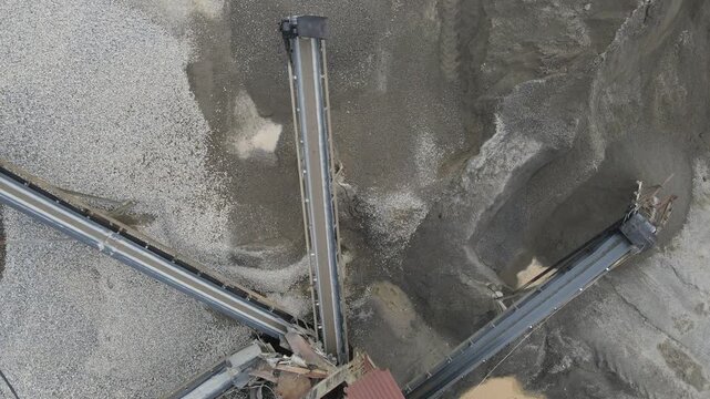 Conveyor Belt System in Quarry Near Rock Crusher Facility, Mining and Material Processing Site view from above