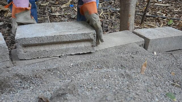Close Up of Placing Concrete Block on Wall