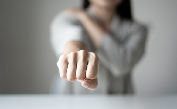 Woman having shoulder pain pain during work long time. stretching to relax and relax while working hard at the office