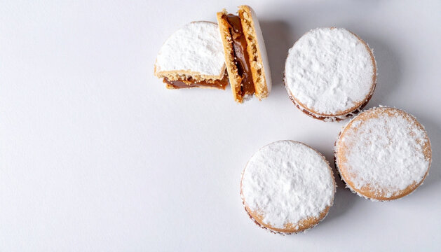 Traditional Argentinian alfajores on white background