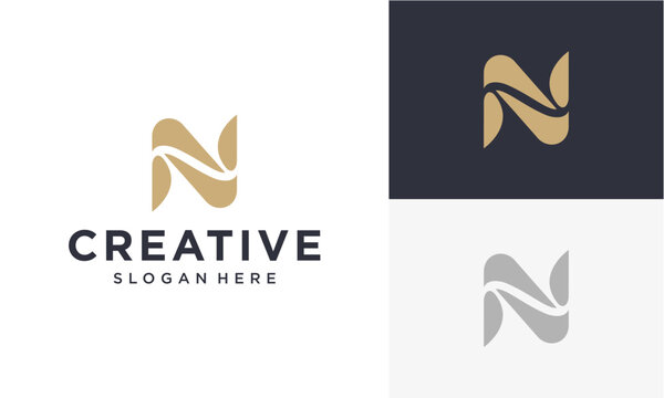 Elegant 'N' letter logo design in gold and navy blue, perfect for branding and creative businesses