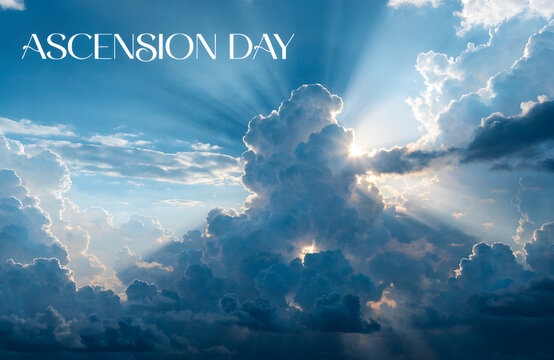 Ascension Day religious background with divine sun rays, heavenly blue sky with dramatic clouds, spiritual light beams for Christian holiday celebration