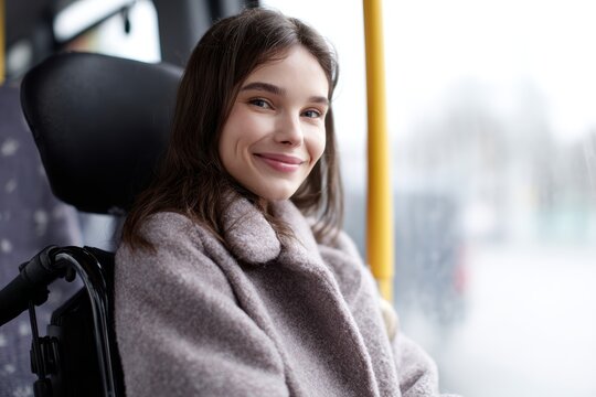 teenage girl smiling in wheelchair riding modern city bus accessible public transportation concept