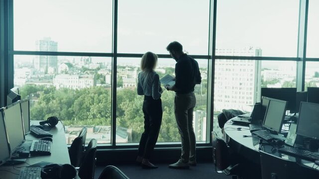 Corporate Colleagues Discussing Project Documents. Analyzing Data Against City Panoramic View. Professional Team Meeting 