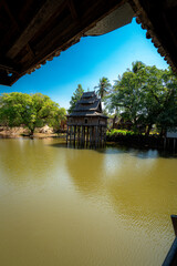 Obraz premium Hotay Pidok Buddhist library vertical portrait stilts water Lamchan Laos