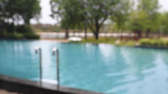 Abstract blur outdoor swimming pool in tropical resort hotel summer background